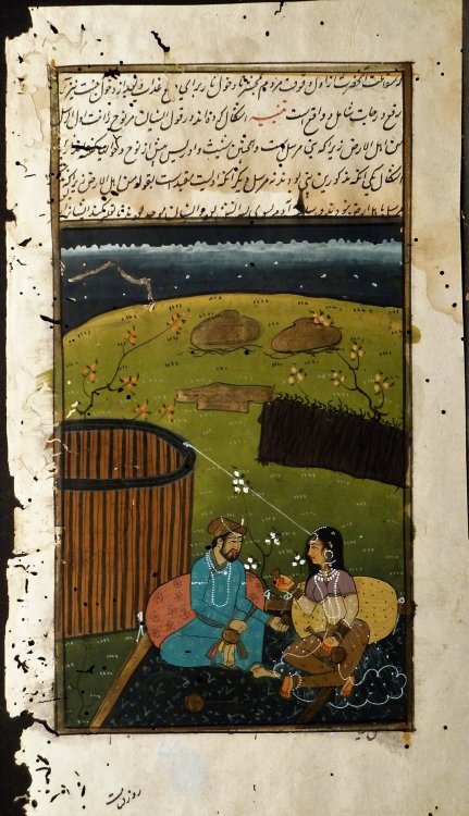 A Persian Man & Woman In A Garden
